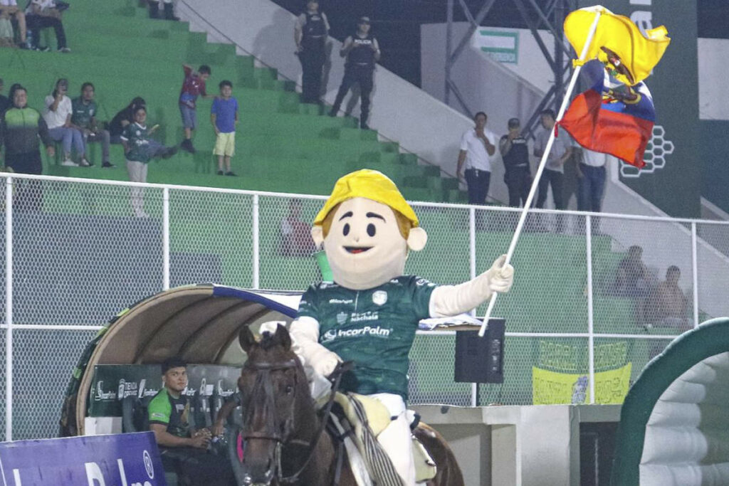 Imagen representativa de la presencia en Brasil de la mascota junto a la bandera nacional.